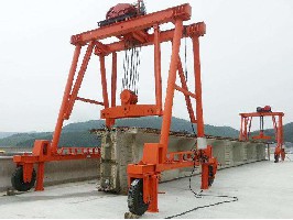 Wheel type beam lifting machine